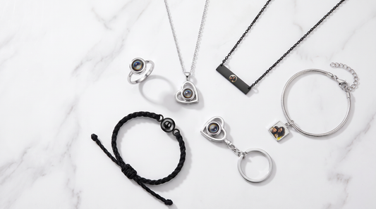 Six types of picture jewelry in a flat-lay including photo necklace, photo bracelet, and photo keychain