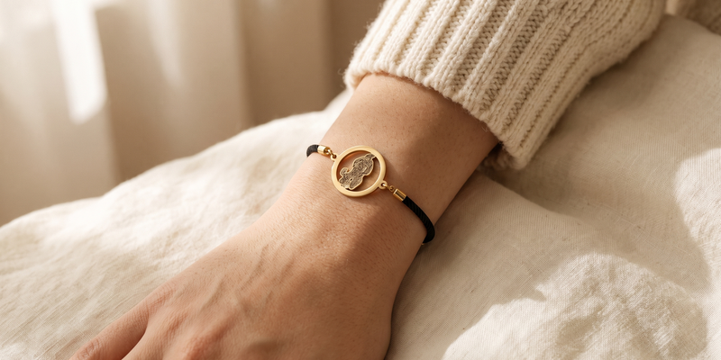 Woman wearing gold dog silhouette halo memorial bracelet — personalized pet memorial jewelry by Dazzle Wears