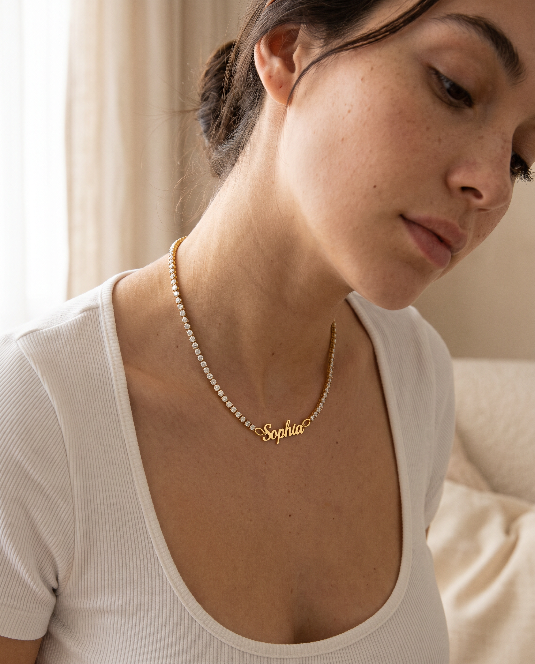 Custom signature name tennis necklace worn on neck, personalized as Sophia