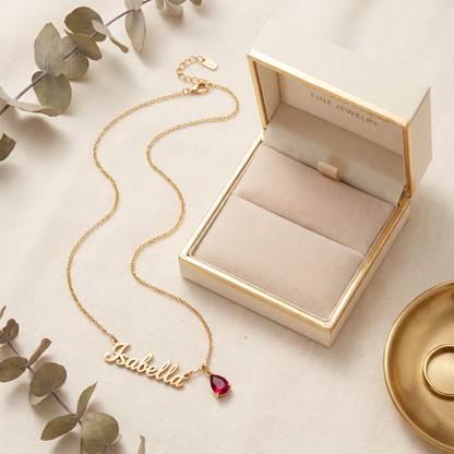 Personalized name and birthstone necklace with gift box flat lay