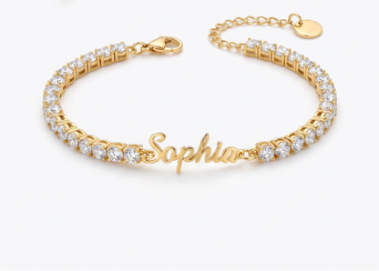 Custom signature name tennis bracelet, close up flat lay in gold